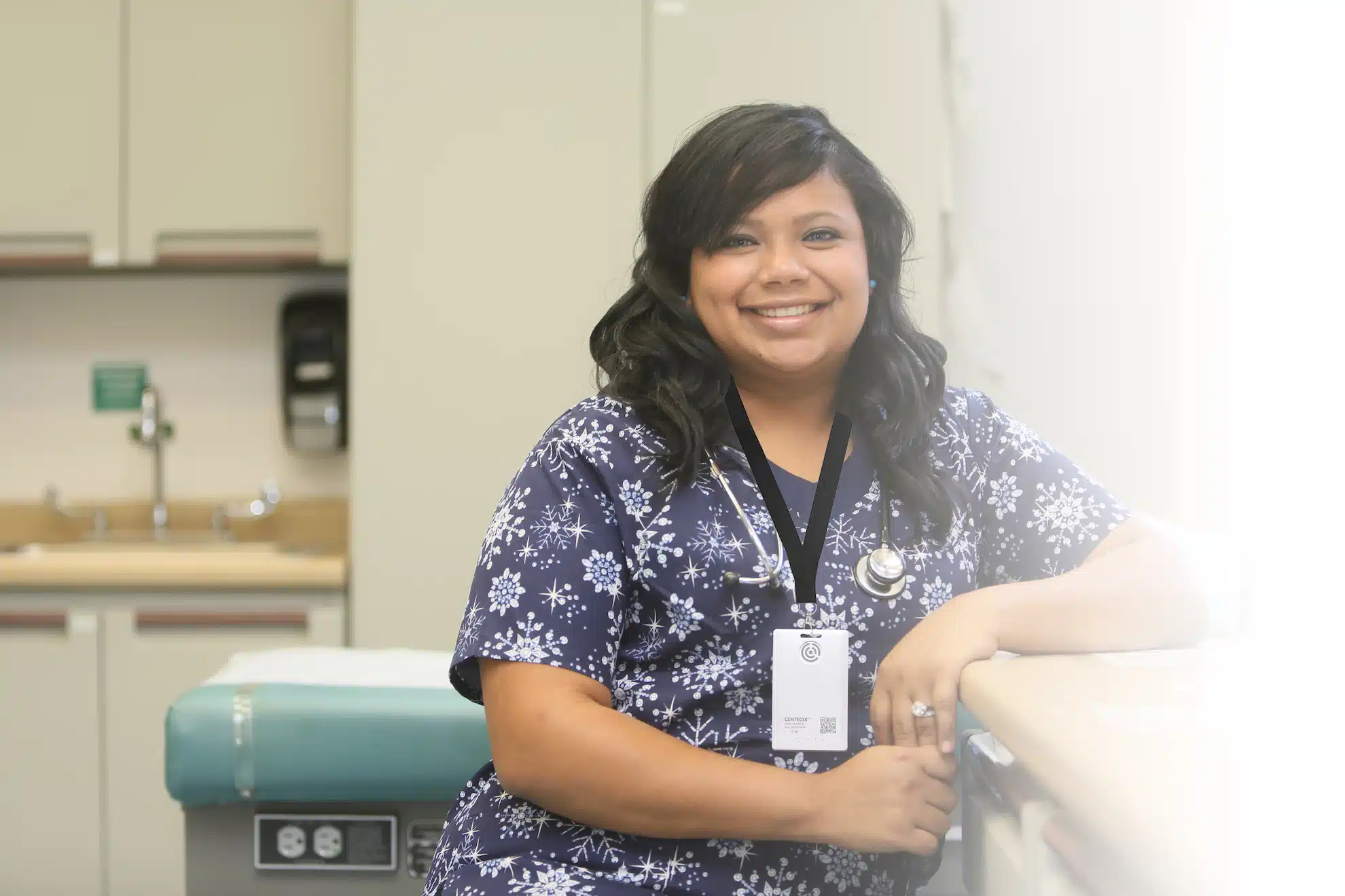 Nurse with badge standing in office